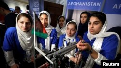 FILE - All-girl team from Afghanistan prepares to compete in first international robot Olympics. They were originally denied entry into the U.S but were later allowed to participate in Washington, U.S., July 17, 2017.