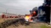 In this handout photo released by the Russian Emergency Ministry Press Service April 1, 2022, firefighters work at the site of fire at an oil depot in Belgorod, Russia.