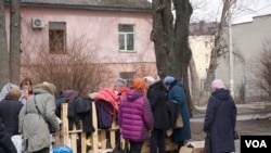 Nearby some of the displaced sorted through items already out for them in front of the cathedral. “People cone here from the East and south of Ukraine with nothing," says Maria, a 30-year-old local journalist.