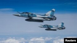 Two Mirage 2000-5F fighter jets of the French Air Force are seen next to an Airbus A330 MRTT &quot;Phenix&quot; in the airspace of Poland as part of NATO&#39;s enhanced Air Policing (eAP) to secure the skies over Baltic allies.