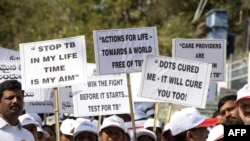 Members of the Tuberculosis (TB) Association of India carry placards as they take part in an awareness rally in connection with World Tuberculosis Day in Hyderabad on March 25, 2019. 