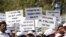 Members of the Tuberculosis (TB) Association of India carry placards as they take part in an awareness rally in connection with World Tuberculosis Day in Hyderabad on March 25, 2019. 