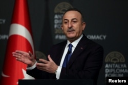 FILE - Turkish Foreign Minister Mevlut Cavusoglu speaks during a news conference, in Antalya, Turkey, March 10, 2022.