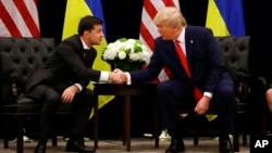 FILE - Ukrainian President Volodymyr Zelenskyy, left, meets with former U.S. President Donald Trump at the InterContinental New York Barclay in New York City, Sept. 25, 2019.