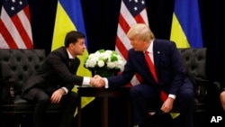 FILE - In this Sept. 25, 2019, photo, then-President Donald Trump meets with Ukrainian President Volodymyr Zelenskyy at the InterContinental New York Barclay in New York City. Trump is set to meet today with Zelenskyy at Trump Tower in New York. 