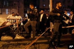 Police secure the site where a a gunman opened fire in Bnei Brak, Israel, March 29, 2022.