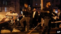 Police secure the site where a a gunman opened fire in Bnei Brak, Israel, March 29, 2022. 