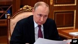 Rais wa Russia Vladimir Putin katika mojawapo ya mikutano yake mjini Moscow, March 21, 2022. Picha ya AP