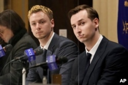 Ukraine's YouYubers Sava Tkachov, right, and his young brother Yan Tkachov attend a news conference at the Foreign Correspondents Club of Japan in Tokyo, Thursday, March 31, 2022. (AP Photo/Shuji Kajiyama)
