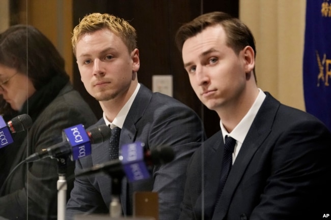 Ukraine's YouYubers Sava Tkachov, right, and his young brother Yan Tkachov attend a news conference at the Foreign Correspondents Club of Japan in Tokyo, Thursday, March 31, 2022. (AP Photo/Shuji Kajiyama)