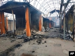 FILE - The city market is seen damaged by night shelling in Chernihiv, Ukraine, March 30, 2022.