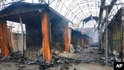 The city market is seen damaged by night shelling in Chernihiv, Ukraine, March 30, 2022. Ukrainian officials say Russian forces pounded areas around Kyiv overnight.