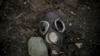 A damaged gas mask lies on the pavement at a Russian position which was overrun by Ukrainian forces, outside Kyiv, Ukraine, March 31, 2022. 