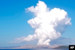 FILE - Taal Volcano spews white steam and ash as seen from Balete, Batangas province, south of Manila, Philippines, on March 26, 2022. (AP Photo/Reynante Olitan De Villa)