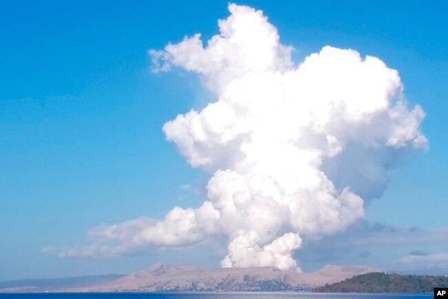 FILE - Taal Volcano spews white steam and ash as seen from Balete, Batangas province, south of Manila, Philippines, on March 26, 2022. (AP Photo/Reynante Olitan De Villa)