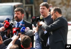 Mykhailo Podolyak, a member of the Ukrainian delegation, center right, speaks to the media after talks between Russian and Ukrainian delegations, in Istanbul, March 29, 2022.