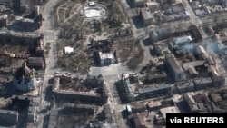 A satellite image shows a view of Mariupol Drama Theatre aftermath of an airstrike, in Mariupol, Ukraine, March 19, 2022. Courtesy Maxar Technologies.