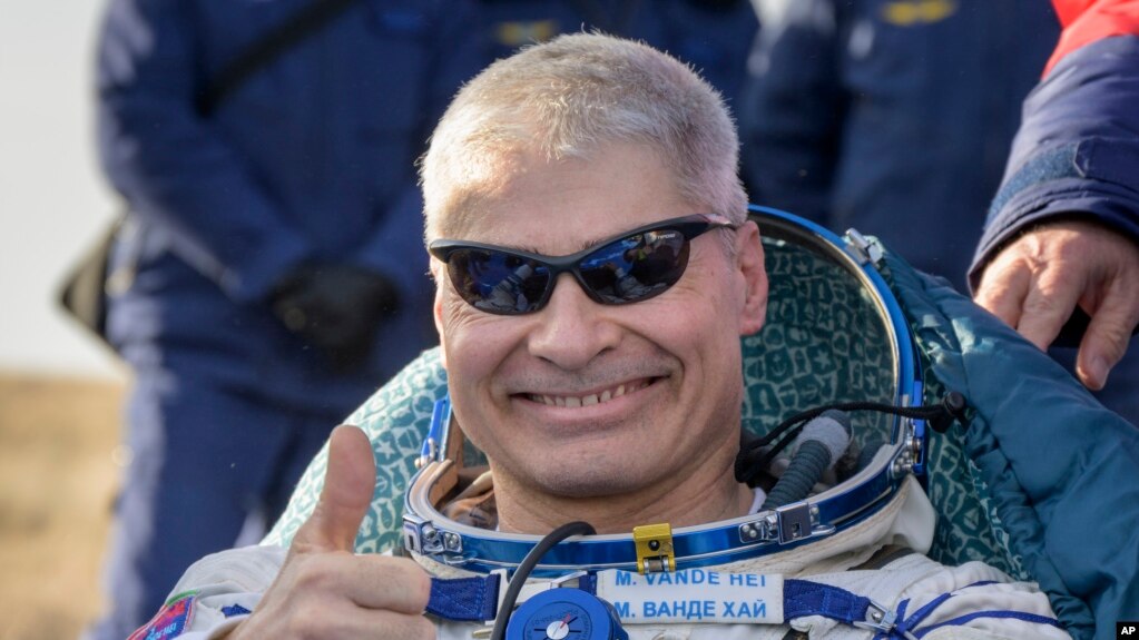 NASA astronaut Mark Vande Hei gives the thumbs up outside the Soyuz MS-19 spacecraft after he landed with Russian cosmonauts Anton Shkaplerov and Pyotr Dubrov in a remote area near the town of Zhezkazgan, Kazakhstan on March 30, 2022.