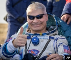 NASA astronaut Mark Vande Hei gives the thumbs up outside the Soyuz MS-19 spacecraft after he landed with Russian cosmonauts Anton Shkaplerov and Pyotr Dubrov in a remote area near the town of Zhezkazgan, Kazakhstan on March 30, 2022.