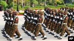 Members of the military march during a parade to commemorate Myanmar's 77th Armed Forces Day in Naypyitaw, Myanmar, March 27, 2022. 