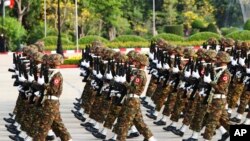 Members of the military march during a parade to commemorate Myanmar's 77th Armed Forces Day in Naypyitaw, Myanmar, March 27, 2022.