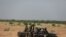 FILE - Niger's army soldiers ride on a pickup truck near Agadez, Niger, Oct. 29, 2019.