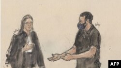 This court-sketch made on March 30, 2022 shows French lawyer Claire Josserand-Schmidt, listening to co-defendant Salah Abdeslam, the prime suspect in the attacks.