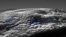 This image released by NASA/Johns Hopkins University Applied Physics Laboratory/Southwest Research Institute on March 29, 2022, shows a perspective view of Pluto's icy volcanic region. The surface and atmospheric hazes of Pluto are shown here in grayscale.