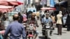 Men ride on motorbikes as others walk on a street hours before a two-month nationwide truce is to take effect, in Sanaa, Yemen. (File)