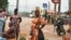FILE - Street vendors are seen in Noe, a border town between Ivory Coast and Ghana where residents have not been able to cross due to the COVID-19 pandemic, Sept. 22, 2021. 
