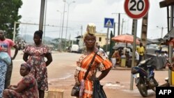 FILE - Street vendors are seen in Noe, a border town between Ivory Coast and Ghana where residents have not been able to cross due to the COVID-19 pandemic. Taken Sept. 22, 2021. 