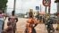 FILE - Street vendors are seen in Noe, a border town between Ivory Coast and Ghana where residents have not been able to cross due to the COVID-19 pandemic. Taken Sept. 22, 2021. 