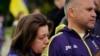 Natalia Kurkchy leans her head on the shoulder of her husband, Peter, during a protest of the Russian invasion of Ukraine held in Sacramento, Calif., Feb. 24, 2022. The Kurkchy's immigrated in 2015 and are concerned for family members in Ukraine.