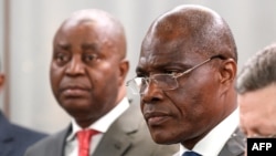 Democratic Republic of Congo joint opposition presidential candidate Martin Fayulu (C) is congratulated by other opposition leaders (from L) Jean-Pierre Bemba, Adolphe Muzito, Kofi Annan Foundation president Alan Doss and Freddy Matungulu during a press c