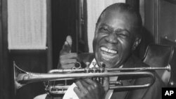 Jazz trumpeter Louis Armstrong shown in the upstairs den of his Corona, New York home, June 23, 1971. 
