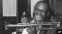 Jazz trumpeter Louis Armstrong shown in the upstairs den of his Corona, New York home, June 23, 1971. 