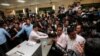 FILE- Journalists gather at a polling station where Cambodia's Prime Minister and President of the Cambodian People's Party (CPP) Hun Sen will cast a vote during a general election in Takhmao, Kandal province, Cambodia July 29, 2018. REUTERS/Samrang Pring