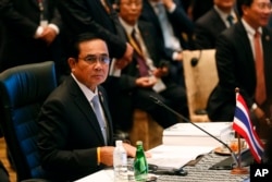 FILE - Thailand's Prime Minister Prayuth Chan-o-cha prepares before the Association of Southeast Asian Nations (ASEAN) summit in Kuala Lumpur, Malaysia, Nov. 21, 2015.