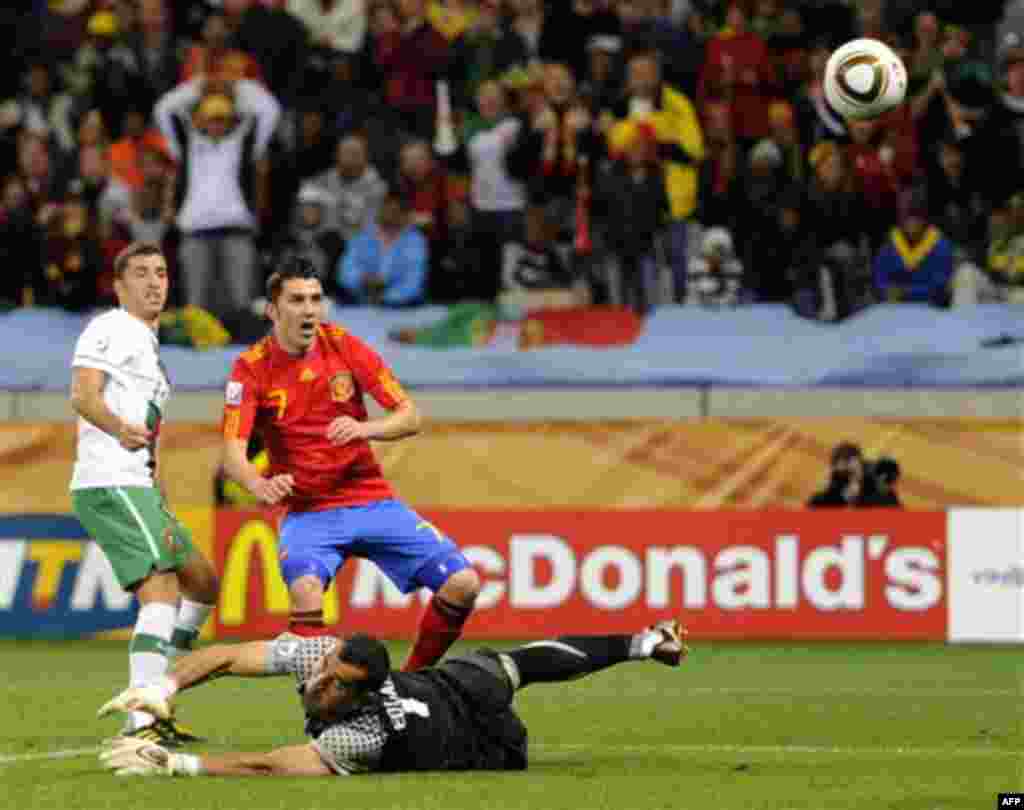 Spain's David Villa, center back, scores the opening goal past Portugal goalkeeper Eduardo, center front, during the World Cup round of 16 soccer match between Spain and Portugal at the Green Point stadium in Cape Town, South Africa, Tuesday, June 29, 201