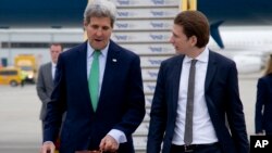 U.S. Secretary of State John Kerry (L) walks to his car with Austria's Foreign Minister Sebastian Kurz as he arrives at Vienna International Airport, in Vienna, Austria, Oct. 15, 2014. 