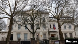 FILE - A pedestrian walks past the Russian Embassy in London, Feb. 16, 2024. 