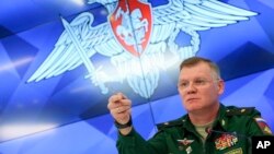 Defense Ministry spokesman Maj. Gen. Igor Konashenkov speaks to the media during a press conference, in Moscow, Russia, Sept. 17, 2018.