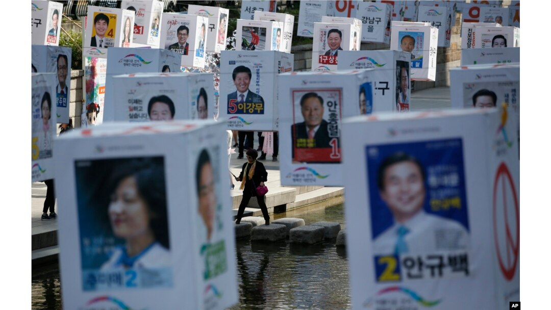 Candidates' posters for the upcoming general elections are hung on strings over the Cheonggye stream in downtown Seoul, South Korea, Monday, April 11, 2016.