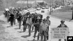 In this file photo, a portion of the more than 1000 anti-nuclear power demonstrators march toward the front gate of the Seabrook nuclear power station construction site in this April 30, 1977 file photo in Seabrook, N.H. (AP Photo)