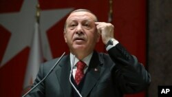 Turkey's President Recep Tayyip Erdogan addresses to his ruling party's provincial leaders in Ankara, Turkey, Nov. 17, 2017. 