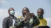 FILE - South Africa and Africa National Congress President Cyril Ramaphosa addresses a crowd of supporters during a visit at Nomzamo informal settlement in Soweto, September 18, 2021.