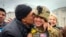 A Kherson resident kisses a Ukrainian soldier in central Kherson, Ukraine, Nov. 13, 2022. 