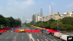 Barriers form a security checkpoint in the Haizhu district in Guangzhou in southern China's Guangdong province Nov. 11, 2022.