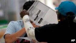 Election workers process ballots at the Clark County Election Department, in Las Vegas, Nevada, Nov. 10, 2022.