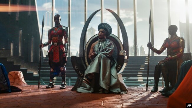 This image released by Marvel Studios shows, from left, Dorothy Steel as Merchant Tribe Elder, Florence Kasumba as Ayo, Angela Bassett as Ramonda, and Danai Gurira as Okoye in a scene from